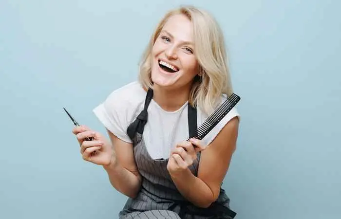 Woman with blonde hair and side-swept bangs
