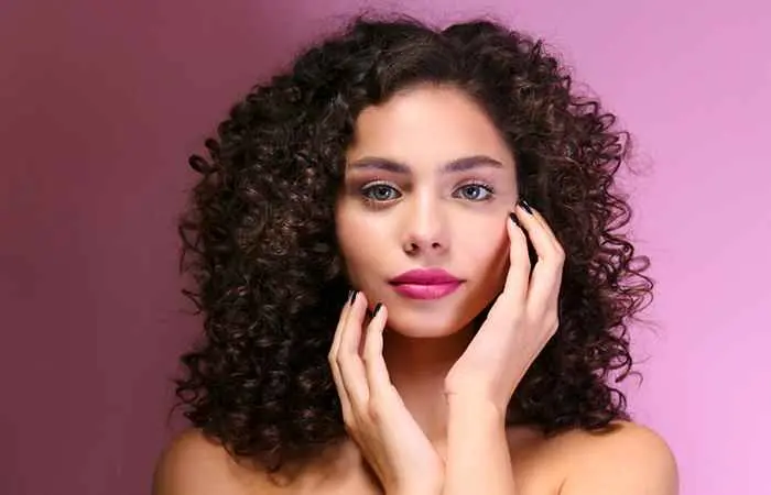 Woman with dark brown curly bob hairstyle