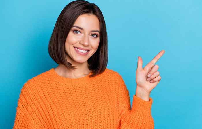 Woman with sleek long bob hairstyle with center parting