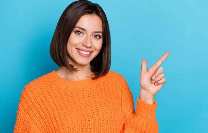 Woman with sleek long bob hairstyle with center parting