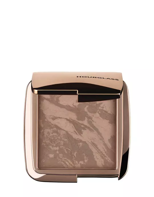 Hourglass Ambient Lighting Bronzer in Nude Bronze Light. Highlighting Bronzer for a Natural Sun-Kissed Glow. Vegan and Cruelty-Free.